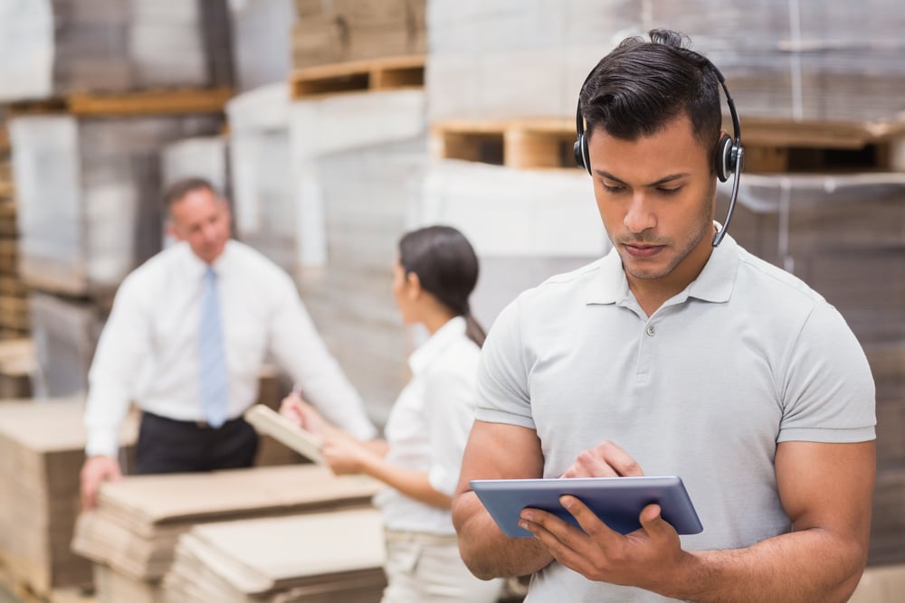 Female manager using digital tablet in warehouse Female manager using digital tablet in warehouse